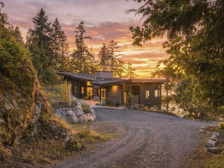Experience breathtaking sunset views from this modern architectural gem nestled amidst lush greenery.