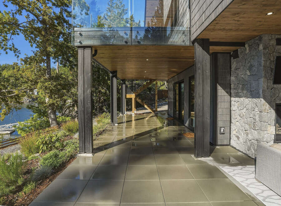 Experience modern living with this stunning home featuring a covered patio perfect for outdoor entertaining.