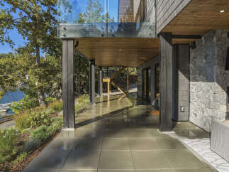 Experience modern living with this stunning home featuring a covered patio perfect for outdoor entertaining.