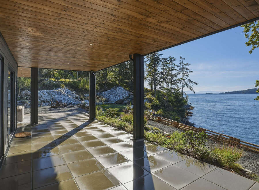 Experience seamless indoor-outdoor living with this stunning covered patio, offering breathtaking ocean views.