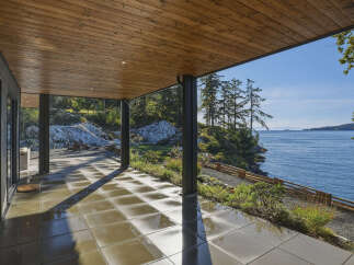 Experience seamless indoor-outdoor living with this stunning covered patio, offering breathtaking ocean views.