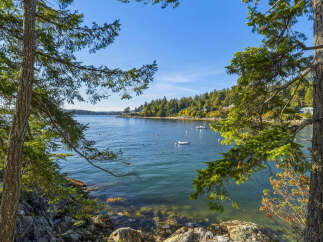 Experience serene waterfront living with this stunning property offering breathtaking ocean views and direct water access.