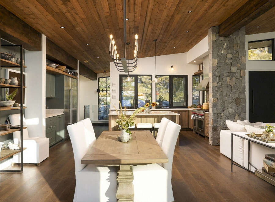 Experience luxury living in this stunning open-concept home, featuring a gourmet kitchen with a large island and top-of-the-line appliances.