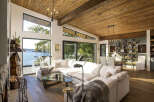 Experience breathtaking waterfront living in this stunning modern home, featuring expansive windows that flood the space with natural light and offer panoramic ocean views.