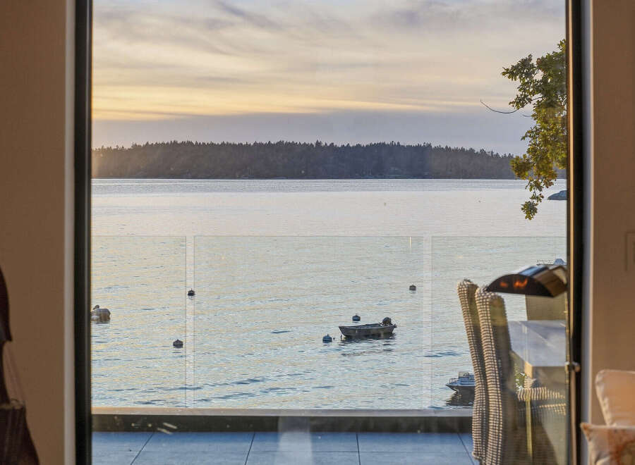 Experience breathtaking sunset views over the water from this stunning property.