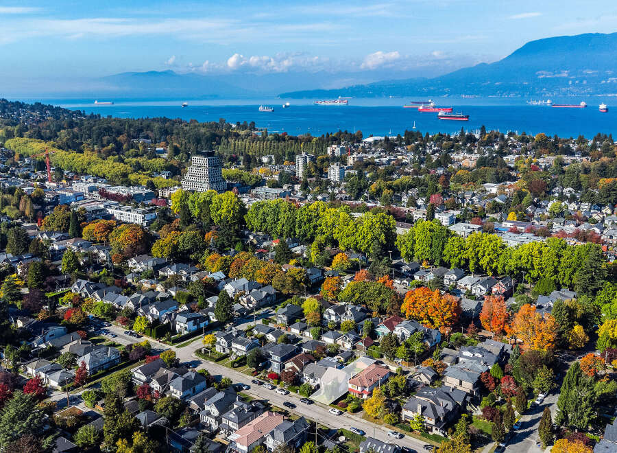 Experience the vibrant beauty of autumn in this aerial view of a charming residential neighborhood.