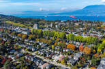 Experience the vibrant beauty of autumn in this aerial view of a charming residential neighborhood.