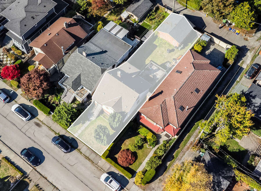 Discover this charming property featuring a spacious backyard with mature trees and a detached garage, perfect for outdoor enjoyment and storage.