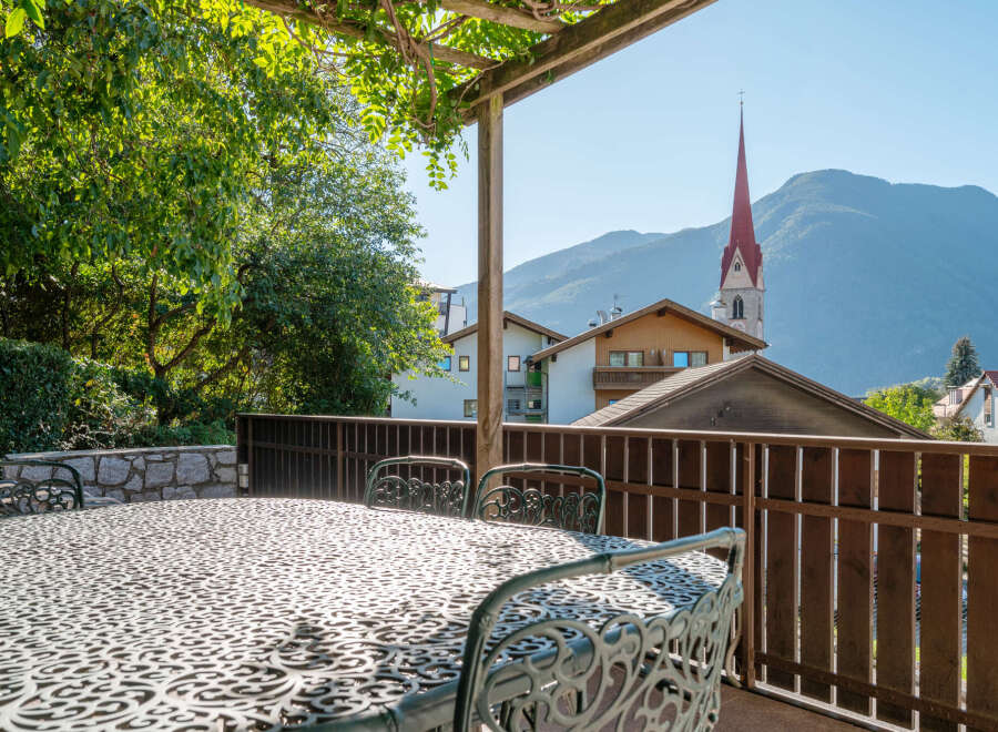 Enjoy breathtaking mountain views from this charming balcony, perfect for al fresco dining or morning coffee.