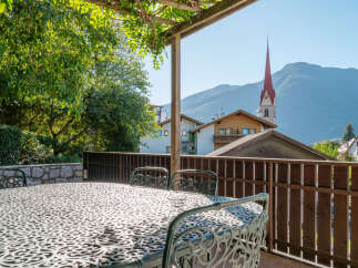 Enjoy breathtaking mountain views from this charming balcony, perfect for al fresco dining or morning coffee.