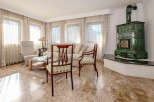 Experience luxurious living in this elegantly appointed living room, featuring a plush sofa, comfortable armchairs, and a stylish coffee table.
