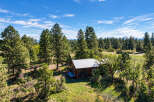 Nestled amidst a serene forest, this charming cabin offers a peaceful retreat.