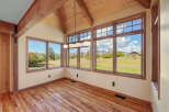 Experience breathtaking panoramic views from this sun-drenched room, featuring expansive windows that showcase the stunning natural landscape.
