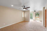 This spacious room features plush carpeting and two ceiling fans for optimal comfort.
