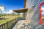 Enjoy the serene mountain views from the expansive covered porch of this charming home.