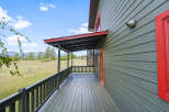 Enjoy the serene mountain views from the expansive covered porch of this charming home.