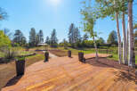 Experience the beauty of nature from this expansive wooden deck, perfect for outdoor entertaining.