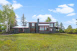 Discover this charming home nestled amidst lush greenery and mature trees, offering a serene retreat.