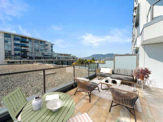 Enjoy breathtaking mountain and city views from this spacious balcony, perfect for entertaining or relaxing.