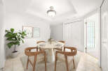 This dining room features a round pedestal table with four chairs, perfect for intimate gatherings.