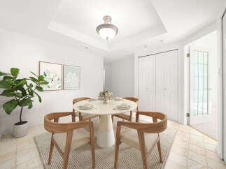 This dining room features a round pedestal table with four chairs, perfect for intimate gatherings.