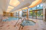Indulge in relaxation with this indoor swimming pool and hot tub, perfect for year-round enjoyment.