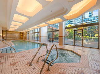 Indulge in relaxation with this indoor swimming pool and hot tub, perfect for year-round enjoyment.