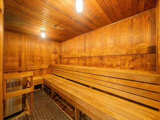 Experience ultimate relaxation in this beautifully crafted wooden sauna.