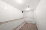 Experience ultimate relaxation in this pristine steam room, featuring tiered seating perfect for unwinding.