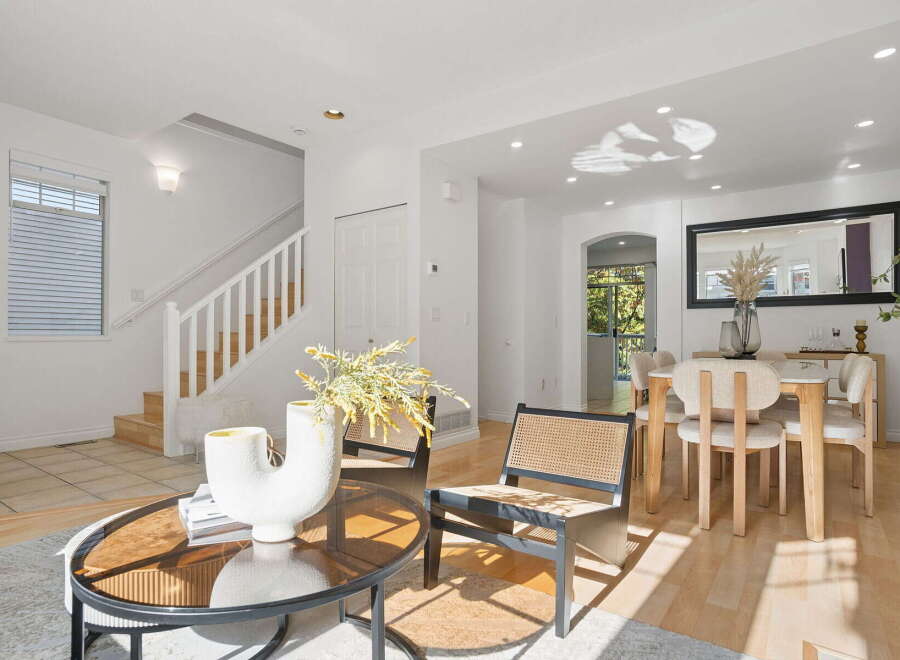 Step into this bright and airy living space, featuring a modern aesthetic with clean lines and a neutral color palette.