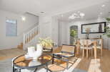 Step into this bright and airy living space, featuring a modern aesthetic with clean lines and a neutral color palette.