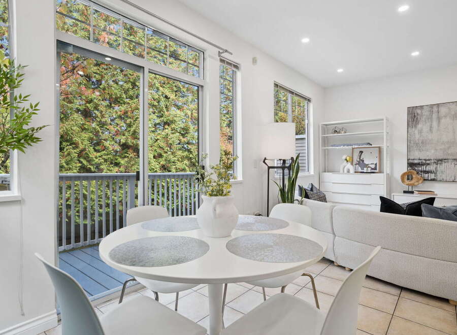 Enjoy abundant natural light and scenic views through the expansive windows and sliding glass doors.