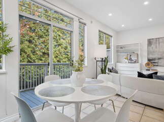 Enjoy abundant natural light and scenic views through the expansive windows and sliding glass doors.