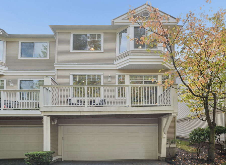 This townhouse offers a spacious deck perfect for outdoor entertaining, overlooking a private backyard.