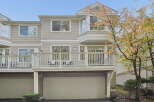This townhouse offers a spacious deck perfect for outdoor entertaining, overlooking a private backyard.