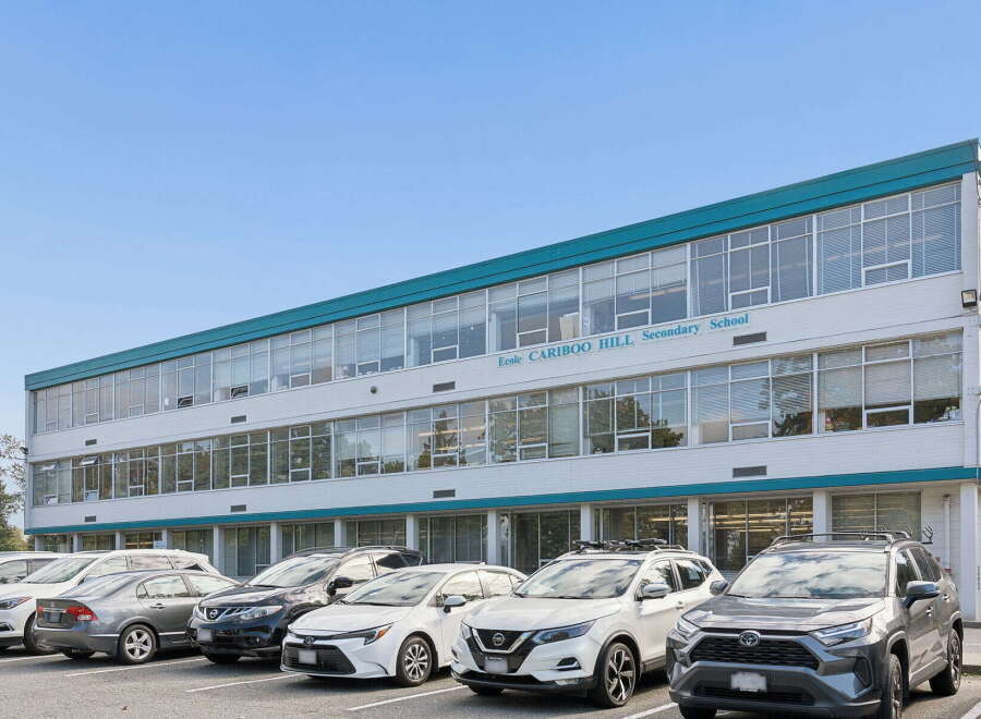 Discover this spacious educational facility, 'Ecole Cariboo Hill Secondary School,' featuring a modern, multi-story design with ample natural light through its extensive window system.
