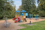 Discover a vibrant community park featuring a colorful playground designed for endless fun.