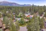 Discover this charming home nestled amidst a serene forest setting, offering a peaceful retreat with stunning mountain views in the distance.