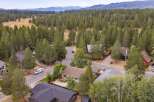 Discover this charming home nestled amidst a serene forest landscape, offering a tranquil retreat.