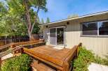 Step outside to a charming wooden deck, perfect for enjoying the outdoors.
