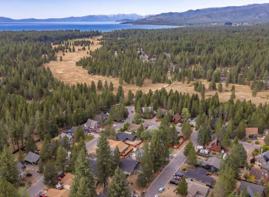 Discover this charming home nestled amidst a dense forest, offering a serene and private retreat.