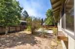 Discover this charming backyard, perfect for outdoor living and entertaining.