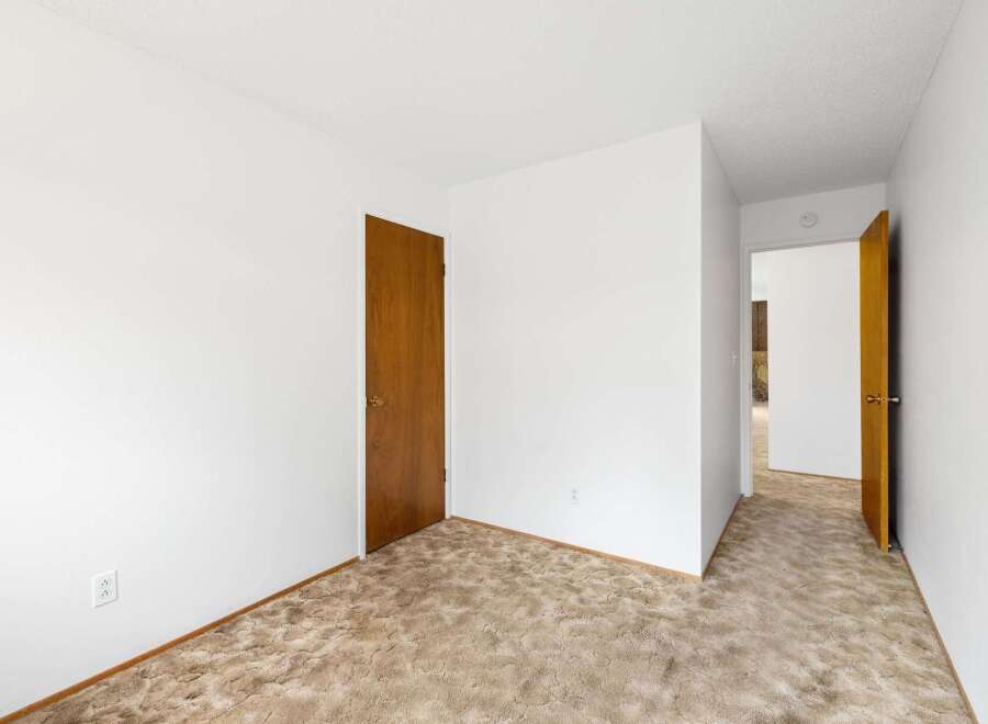 Step into this inviting space featuring plush, neutral-toned carpeting that adds warmth and texture to the room.