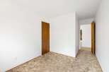Step into this inviting space featuring plush, neutral-toned carpeting that adds warmth and texture to the room.