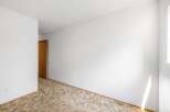This spacious room features a warm, neutral-toned carpet that adds a cozy feel.