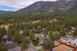 Nestled amidst a dense forest and towering mountains, this property offers a serene retreat.