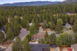 Discover this charming home nestled amidst a dense forest, offering a serene and private retreat.