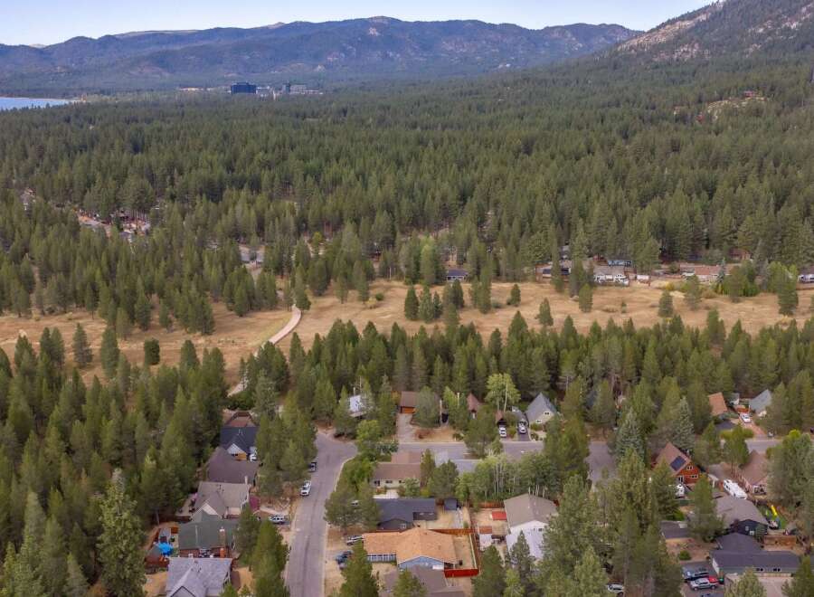 Discover this charming neighborhood nestled amidst a dense forest, offering a serene and private living experience.