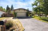 This charming single-family home features a spacious two-car garage, perfect for vehicles and storage.