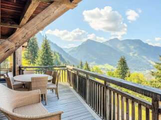 Experience breathtaking mountain views from this charming balcony, perfect for enjoying your morning coffee or evening wine.